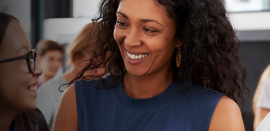 Woman teacher smiling at a student
